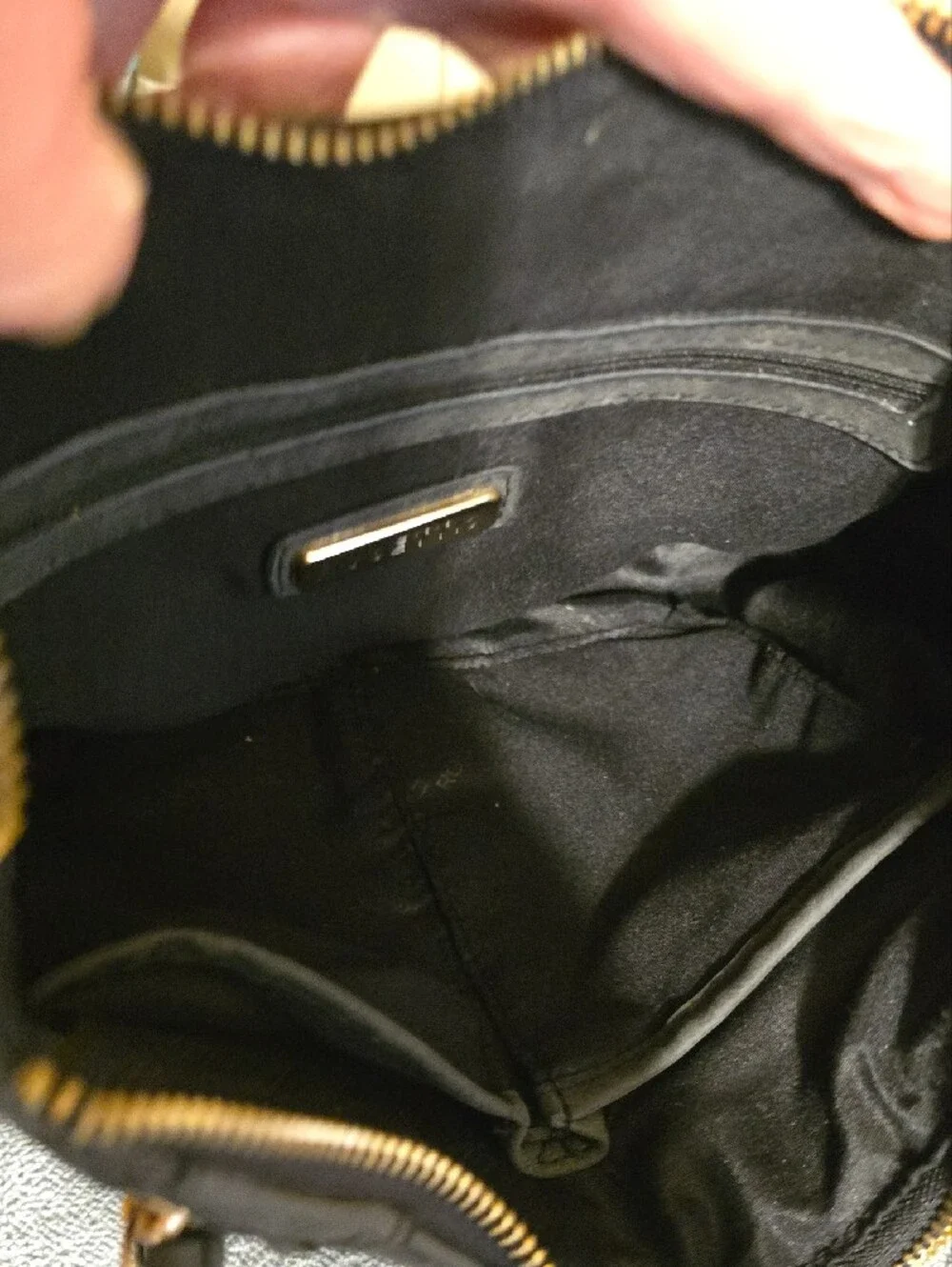 Rosetti Black Suede Drawstring Crossbody Bag with Gold Hardware